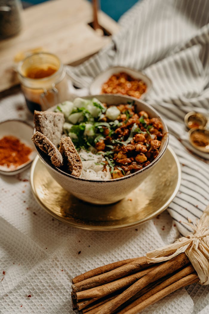 The Art of Drawing Readers In: Your attractive post title goes here A delicious, healthy vegan bowl featuring chickpeas, rice, cucumbers, and spices. Perfect for a nutritious meal.