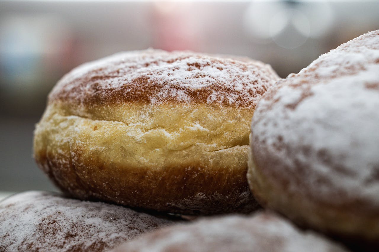 Crafting Captivating Headlines: Your awesome post title goes here Close-up of freshly baked Berliner donuts with powdered sugar. Ideal for food and culinary content.